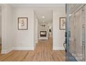 Bright entryway with hardwood floors, fireplace, and recessed lighting at 2717 Madison Oaks Ct, Charlotte, NC 28226