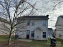 Rear view of a two-story house with a small patio at 5121 Stone Park Dr, Charlotte, NC 28269