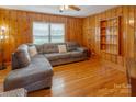 Living room with wood walls and hardwood floors at 6050 Mcconnells Hwy, McConnells, SC 29726