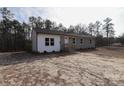 Charming single-story home featuring a combination of brick and siding facade at 868 Monarch Pl, Kershaw, SC 29067