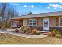 Brick ranch home with updated siding and landscaping at 111 Lois Ct, Statesville, NC 28625