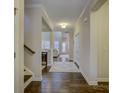 Bright and spacious entryway with hardwood floors and access to staircase at 17627 Caddy Ct, Charlotte, NC 28278