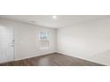 Bright and airy living room with hardwood floors and a large window at 180 Four Andrews Dr, Harmony, NC 28634