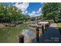 Beautiful waterfront property with a private dock and boats on a peaceful lake setting at 1934 Hickory Hills Dr, Denver, NC 28037