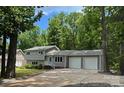 Charming two-story home with a well-maintained front yard and attached two-car garage at 1934 Hickory Hills Dr, Denver, NC 28037