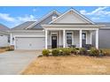 Gray siding craftsman style home with front porch at 111 N Shayna Rd, Troutman, NC 28166