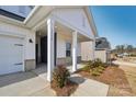 Charming front porch with brick columns and landscaping at 1535 Harper Landing Blvd, Stanley, NC 28164