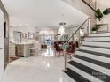 Elegant entryway with marble floors and modern staircase at 18015 Kings Point Dr # F, Cornelius, NC 28031