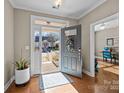 Bright entryway with hardwood floors and view to the front porch at 18119 Coulter Pkwy, Cornelius, NC 28031