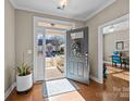 Welcoming foyer with wood floors, open doorway, and view to front yard at 18119 Coulter Pkwy, Cornelius, NC 28031
