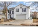 Two-story house with attached garage and landscaping at 2219 Kirkgate Ln, Charlotte, NC 28215