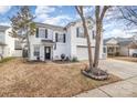 Two-story house with attached garage and landscaping at 2219 Kirkgate Ln, Charlotte, NC 28215