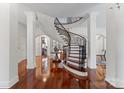 Grand entry with curved staircase and hardwood floors at 2310 La Maison Dr, Charlotte, NC 28226