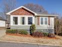 Ranch house featuring gray siding, wood accents, and manicured landscaping at 535 Brooklyn Ave, Cramerton, NC 28032