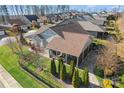 Backyard view of house with screened porch and paver patio at 7145 Hanging Rock Ct, Denver, NC 28037