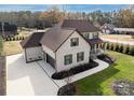 Two-story house with driveway and attached garage, viewed from above at 719 Greenbriar Dr, Matthews, NC 28104