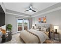 Cozy bedroom with balcony access, stylish decor, and comfortable queen-sized bed at 1315 East Blvd # 433, Charlotte, NC 28203