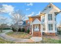 Two-story house with brick and white siding, a walkway, and landscaping at 3297 Su San Farms Rd, Gastonia, NC 28056