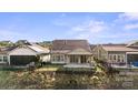 Back exterior with a patio, well-maintained lawn, and privacy fence at 4774 Looking Glass Trl, Denver, NC 28037