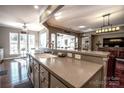 Modern kitchen island with granite countertops and breakfast bar at 5981 Bison Ct, Fort Mill, SC 29707