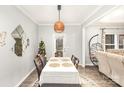 Bright dining room featuring a table with four chairs and access to backyard at 619 Samet St, Fort Mill, SC 29715