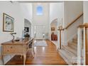 Bright and spacious entryway with hardwood floors and a view to the staircase at 1102 High Brook Dr, Waxhaw, NC 28173