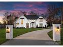 Elegant home featuring brick entrance posts and a winding driveway at 124 Saylors Watch Ln, Mooresville, NC 28117