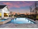 Beautiful pool with lounge chairs and a lake view at 124 Saylors Watch Ln, Mooresville, NC 28117