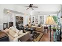 Bright living room with hardwood floors, a fireplace, and ample natural light at 1511 Longbrook Dr, Charlotte, NC 28270