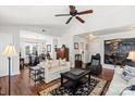 Spacious living room with hardwood floors, vaulted ceilings, and built-in shelving at 1511 Longbrook Dr, Charlotte, NC 28270