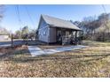 One-story home with covered porch and side yard at 247 Camp Rotary Rd, Gastonia, NC 28052