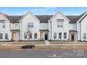 Charming new construction townhome showcases a modern farmhouse design and manicured front yard at 384 Bly St, Rock Hill, SC 29732