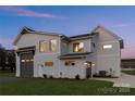 Stylish two-story home with gray siding and attached garage at 104 Isle Of Pines Rd, Mooresville, NC 28117