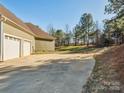 Two-car garage with white doors and ample parking space at 1744 White Fawn Ln, Rock Hill, SC 29730