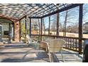 Pergola covered patio furniture overlooking the golf course at 19216 Wildcat Trl, Davidson, NC 28036