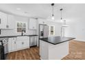 White shaker cabinets, quartz countertops, and stainless steel appliances at 375 Woodwedge Cir, Salisbury, NC 28144