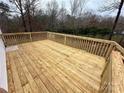 Spacious wooden deck overlooks the wooded backyard at 568 Mahaffey Dr, Salisbury, NC 28146