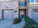 Townhome entry with stone facade and landscaping at 810 Ayrshire Ave, Fort Mill, SC 29708