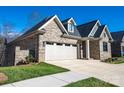 Exterior view of a beautiful brick home with a two-car garage and well-maintained landscaping at 1422 Spring Ridge Ln, Denver, NC 28037