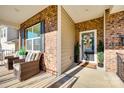 Inviting front porch with wicker chairs, providing a relaxing outdoor space at 1968 Sapphire Meadow Dr, Fort Mill, SC 29715