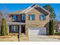 Two-story brick home with a large front yard and two-car garage at 2229 Iron Works Dr, Clover, SC 29710