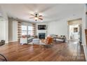 Spacious living room with hardwood floors, fireplace, and access to kitchen at 2229 Iron Works Dr, Clover, SC 29710