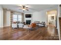 Living room featuring hardwood floors, fireplace and access to half bathroom at 2229 Iron Works Dr, Clover, SC 29710