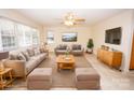 Bright living room features neutral walls, plush seating, a ceiling fan, and ample natural light at 3309 E Broad St, Statesville, NC 28625