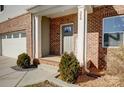 Brick front porch with gray door and welcome sign at 356 Nantucket Way, Rock Hill, SC 29732