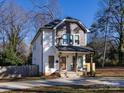 Two-story house with gray and white siding, a front porch, and a landscaped yard at 1019 Trembeth Dr, Charlotte, NC 28205