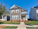 Two-story home with neutral siding and landscaping at 11307 Miller Rd # 101, Pineville, NC 28134