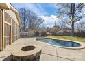 Relaxing backyard oasis with a fire pit and pool at 2008 Townsend Ave, Charlotte, NC 28205