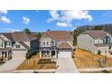 Two-story house, two-car garage, and landscaped yard at 3001 Burton Point Ct, Waxhaw, NC 28173