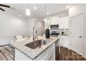 Island kitchen with granite countertops and stainless steel appliances at 3118 Amay James Ave, Charlotte, NC 28208